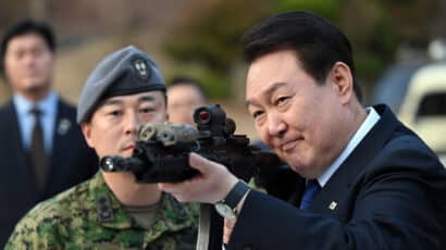 South Korean President Yoon aiming a large gun