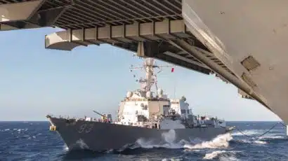 US Navy ships re-fueling at sea in the South China Sea.