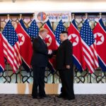 Donald Trump and Kim Jong-un shake hands