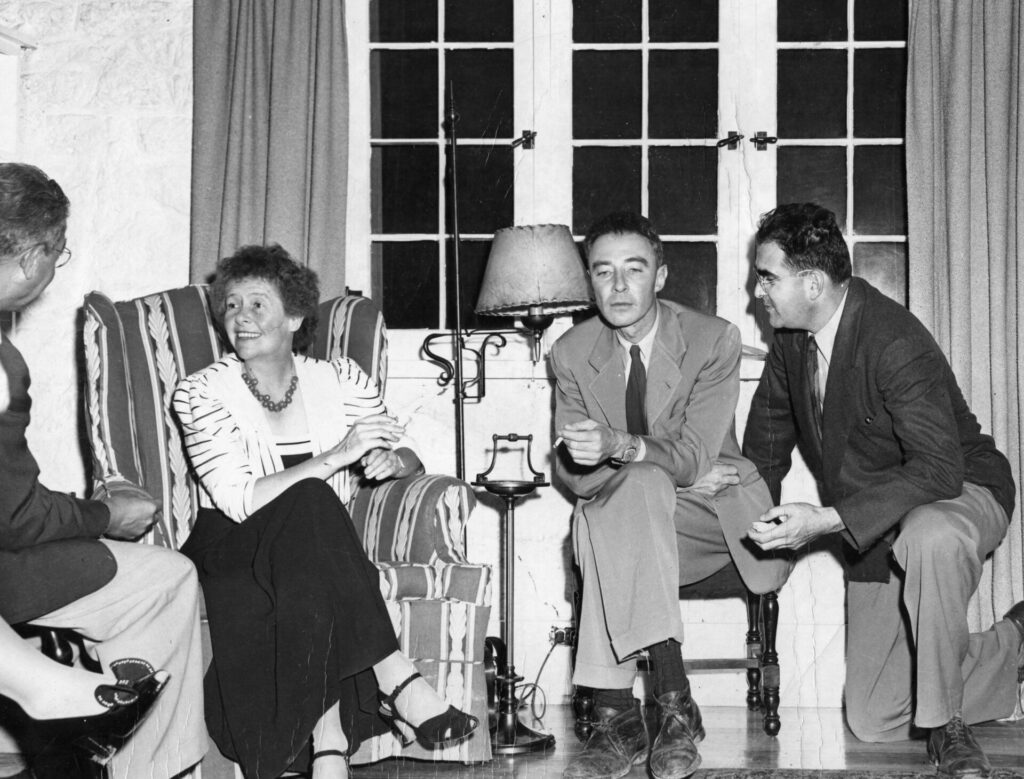 Isidor Rabi, Dorothy McKibben, J. Robert Oppenheimer and Victor Weisskopf converse. Photo credit: American Institute of Physics Emilio Segrè Visual Archives, Physics Today Collection.