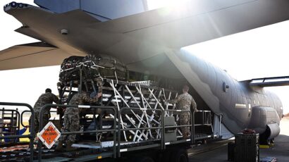 Airmen and riggers with the 1st Special Operations Squadron Logistics Readiness Squadron load a Rapid Dragon palletized weapon system aboard an MC-130J at Hurlburt Field, Florida in December 2021. (US Air Force photo by Staff Sgt. Brandon Esau.)