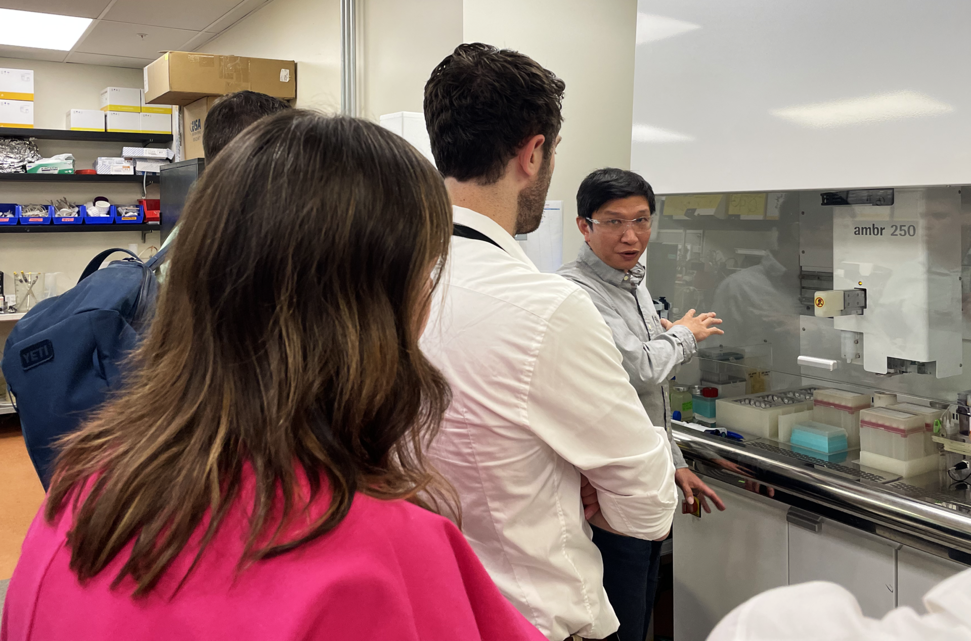 Congressional staffers tour a biotechnology company. 
