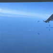 This screen shot from a US Defense Department video clip shows a Russian Su-27 fighter jet flying near an American Reaper drone in March, over the Black Sea near Crimea, spraying what the Defense Department says is jet fuel.