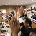 delegates celebration adoption of nuclear ban treaty