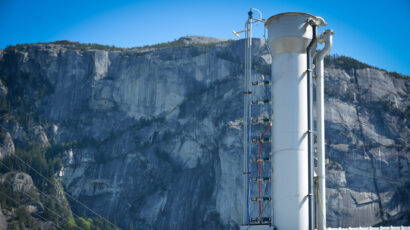 direct air capture plant in front of dramatic rock face mountain