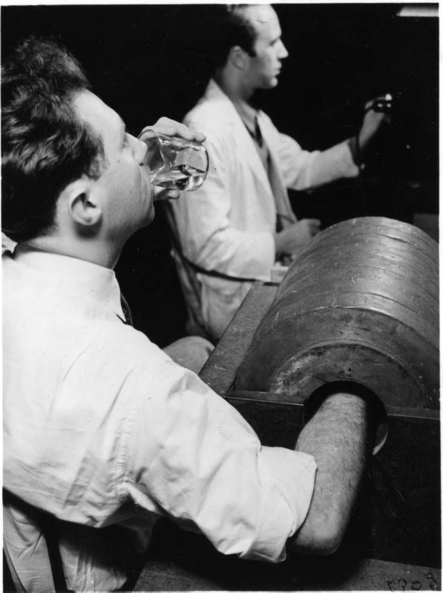 Manhattan Project physicist Robert Marshak drinking radiosodium (rock salt bombarded with deuterons) in January 1939. (Lawrence Berkeley National Laboratory via Wikimedia)