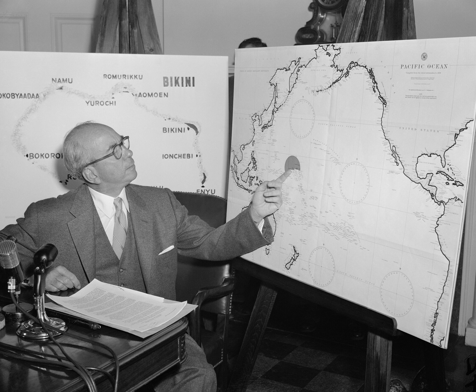 Lewis Strauss, then Chair of the Atomic Energy Commission, points to the spot in a chart of the Pacific where H-bomb tests were conducted in the Marshall Islands. Strauss gave newsmen information on the tests at President Dwight Eisenhower's news conference on March 31, 1954. (AP Photo/Byron Rollins)