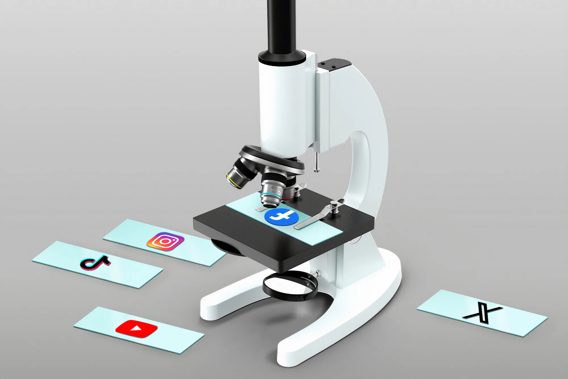 A microscope with cards displaying logos of different social media platforms