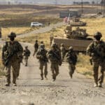 US Army soldiers walking in Syria