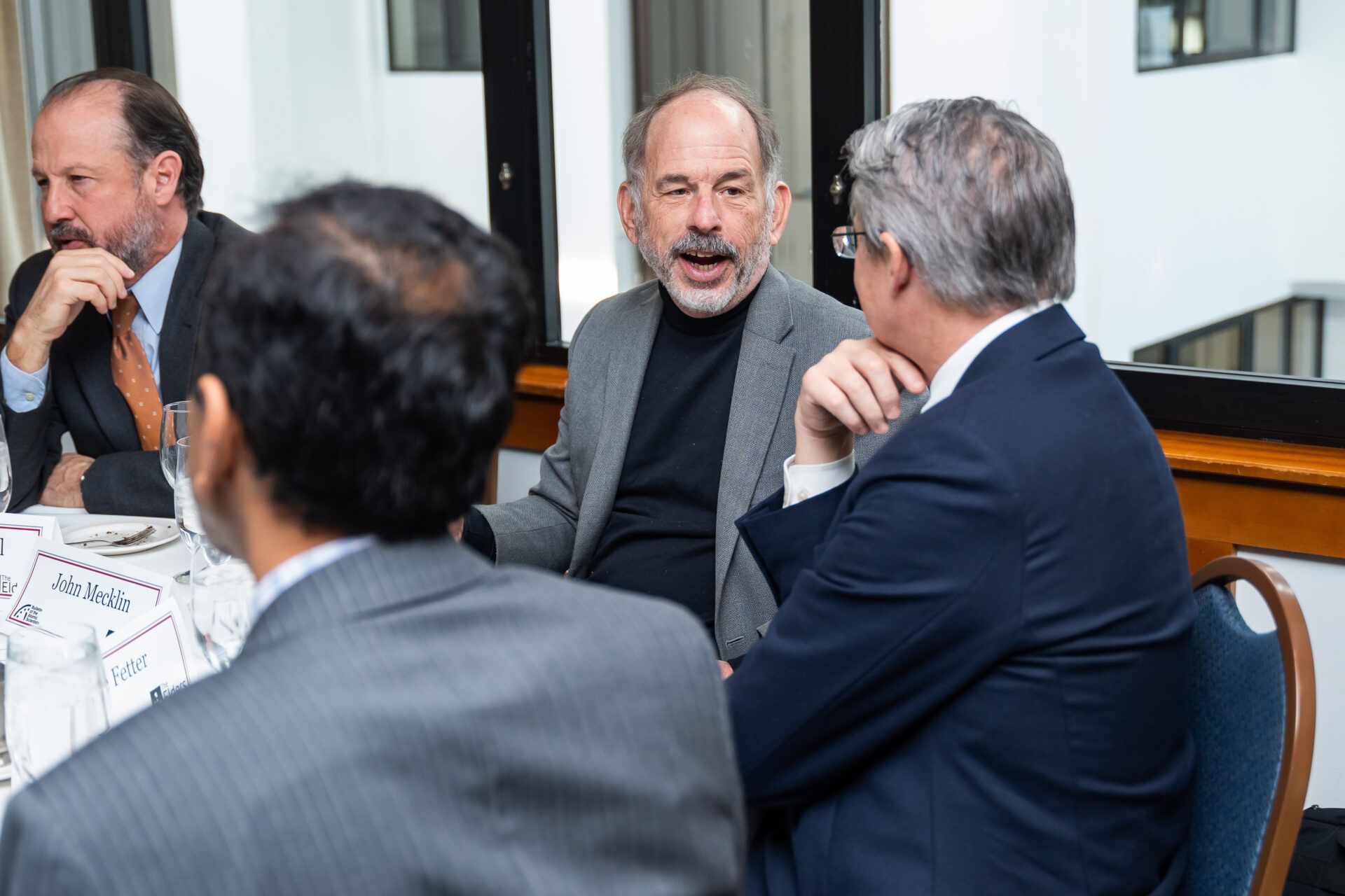 Bulletin editor-in-chief John Mecklin (center) speaks with Bulletin Science and Security Board member Steve Fetter following the 2023 Doomsday Clock announcement.