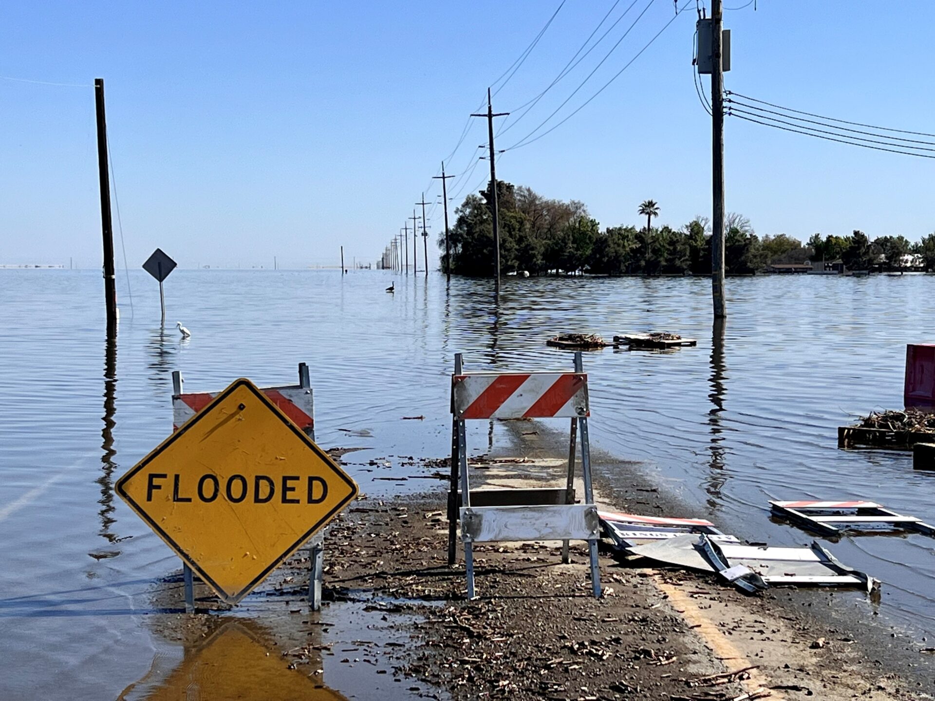 A road in Corcoran, CA, flooded by waters from the refilled Tulare Lake Basin after unprecedented rainfall in February and March 2023. (California Office of Emergency Services)
