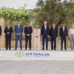 World leaders standing in a row at the 2024 G7 meeting in italy