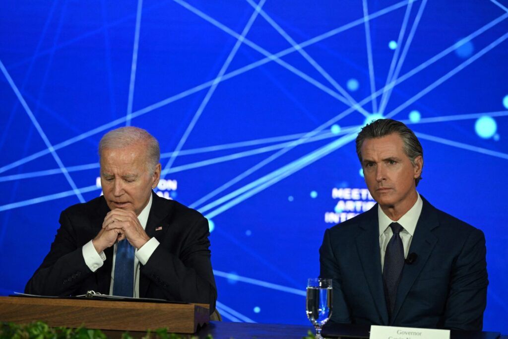 US President Joe Biden (L) and California Governor Gavin Newsom at an event discussing the opportunities and risks of artificial intelligence at the Fairmont Hotel in San Francisco, California in June 2023. (Photo by ANDREW CABALLERO-REYNOLDS/AFP via Getty Images)