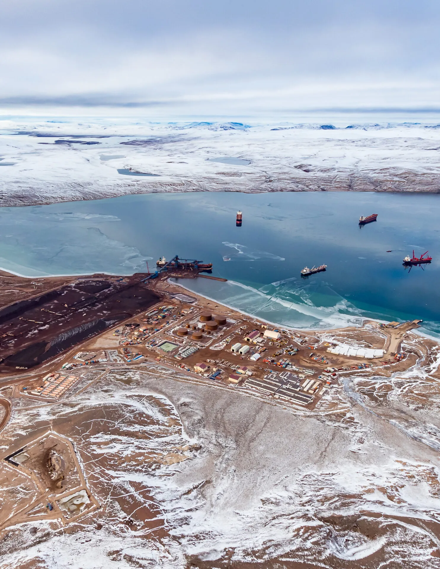 Shipping of ore from the Mary River mine  begins at the Baffinland mining company's Milne Inlet port. As the permafrost melts, microbes emerge and can hitch rides in ships’ ballast water. <span class="credit">Baffinland</span>