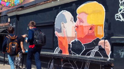 Mural artwork of Russian President Vladimir Putin and U.S. presidential hopeful Donald Trump kissing on the side of a barbecue restaurant in Vilnius, Lithuania in May 2016. Photo by Cebas1