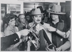 Bill Silkwood, center, and his wife Merle talk with reporters outside the federal courthouse Friday after a three-man, three-woman jury awarded their family $10.5 million damages for the radiation contamination of their daughter Karen. Photo via Getty Images.