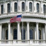 US Capitol with flag