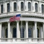 US Capitol with flag