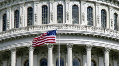 US Capitol with flag