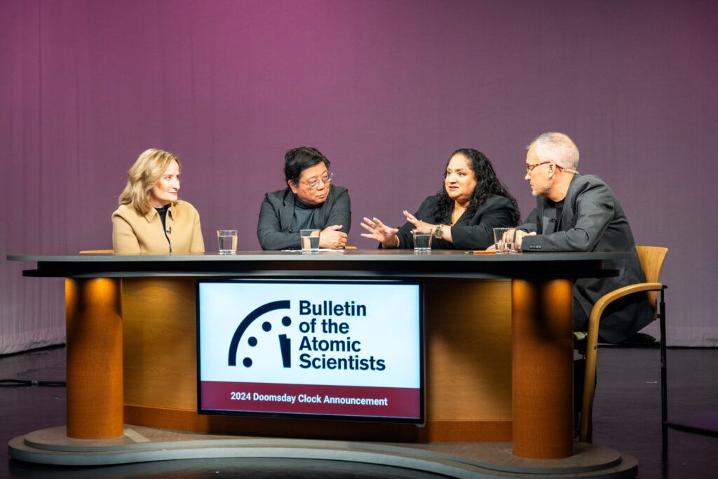 Asha M. George (second to right) speaks at the 2024 Doomsday Clock Announcement alongside, from left to right, Bulletin President and CEO Rachel Bronson and fellow Science and Security Board members Herbert Lin and Alexander Glaser. (Photo: Jamie Christiani).