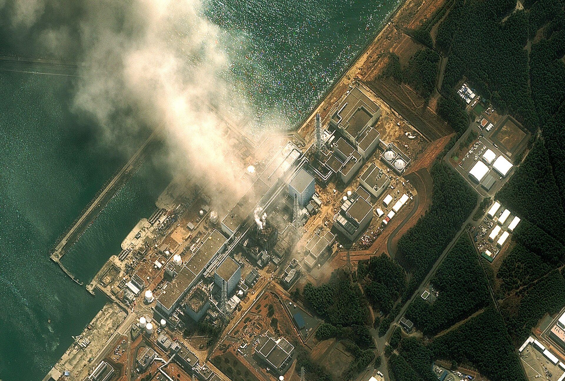 HTMHF4 Fukushima Daiichi reactor in North eastern Japan 2011 Satellite view of earthquake damage to the reactors march14th 2011