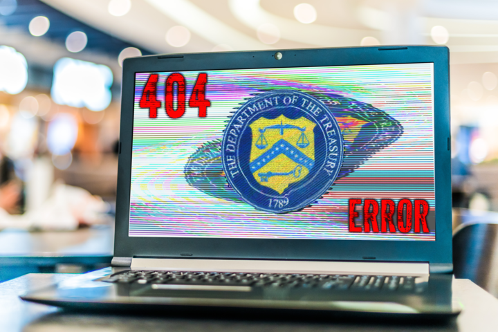 Laptop open to Department of the Treasury page with 404 error