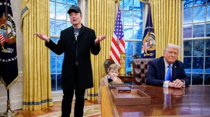 Tesla and SpaceX CEO Elon Musk, accompanied by President Donald Trump and his son X Musk, speaks during an executive order signing in the Oval Office at the White House on February 11. The executive order implements the Department of Government Efficiency's (DOGE) "workforce optimization initiative," which, according to Trump, will encourage agencies to limit hiring and reduce the size of the federal government. (Photo by Andrew Harnik/Getty Images)