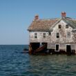 a house surrounded by water