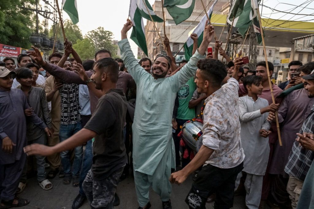 Pakistani people celebrate after the ceasefire between Pakistan and India, in Hyderabad. Pakistan and India agreed to a full and immediate ceasefire on Saturday after days of deadly jet fighter, missile, drone and artillery attacks. The news surprisingly announced by US President Donald, who congratulated them on using "common sense". (Photo by AKRAM SHAHID/AFP via Getty Images)