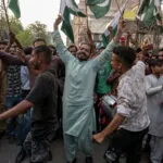 Pakistani people celebrate after the ceasefire between Pakistan and India, in Hyderabad. Pakistan and India agreed to a full and immediate ceasefire on Saturday after days of deadly jet fighter, missile, drone and artillery attacks. The news surprisingly announced by US President Donald, who congratulated them on using "common sense". (Photo by AKRAM SHAHID/AFP via Getty Images)