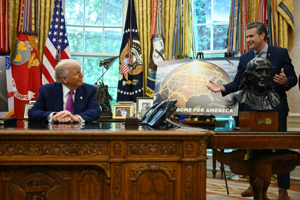 US President Donald Trump listens to US Secretary of Defense Pete Hegseth speak about the Golden Dome missile defense shield in the Oval Office on May 20. (Photo by JIM WATSON/AFP via Getty Images)