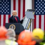 President Donald Trump signs an Executive Order on the Administration’s tariff plans at a “Make America Wealthy Again” event, Wednesday, April 2, 2025, in the White House Rose Garden.