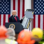 President Donald Trump signs an Executive Order on the Administration’s tariff plans at a “Make America Wealthy Again” event, Wednesday, April 2, 2025, in the White House Rose Garden.
