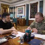 President of Ukraine Volodymyr Zelensky listening to the Head of the Security Service of Ukraine Vasyl Malyuk