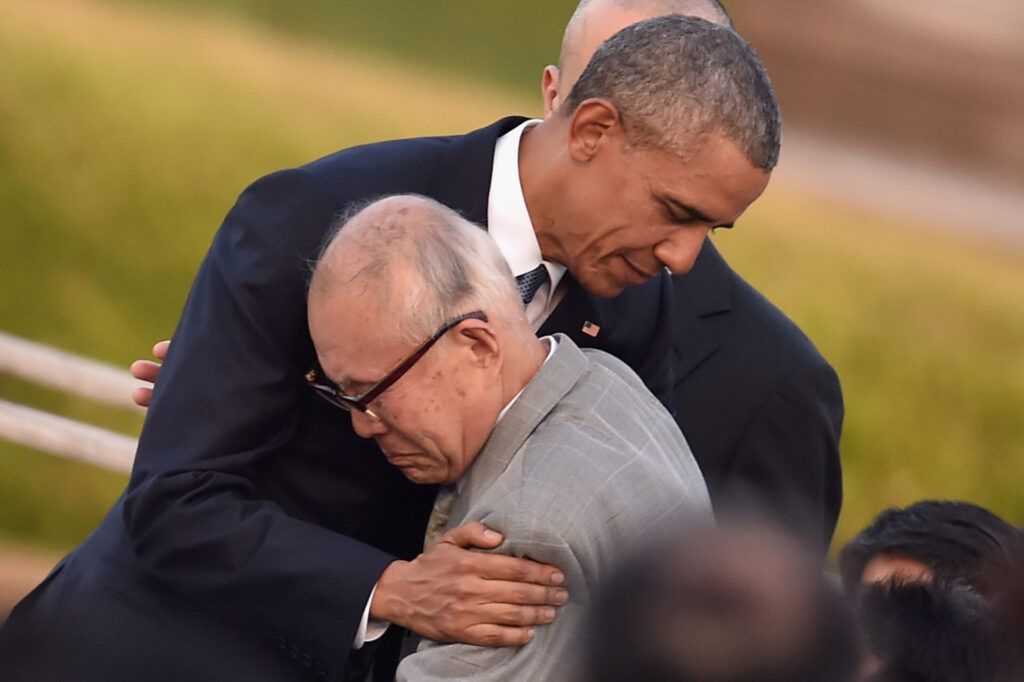 US President Barack Obama embraces an a-bomb victim at the Hiroshima Peace Memorial Park on May 27, 2016 in Hiroshima, Japan. It was the first time a US president made an official visit to Hiroshima, the site where the atomic bomb was dropped on August 6, 1945. (Photo by Atsushi Tomura/Getty Images)
