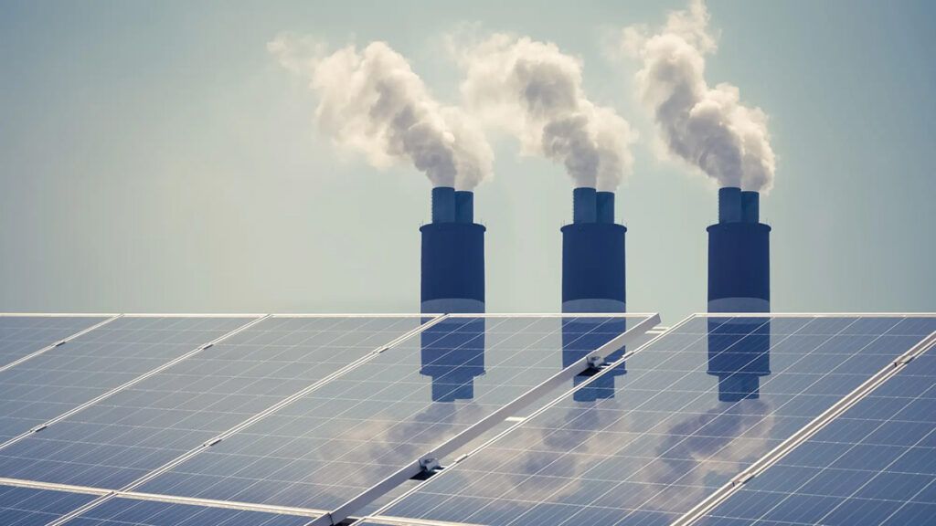 solar panels and coal-fired chimneys