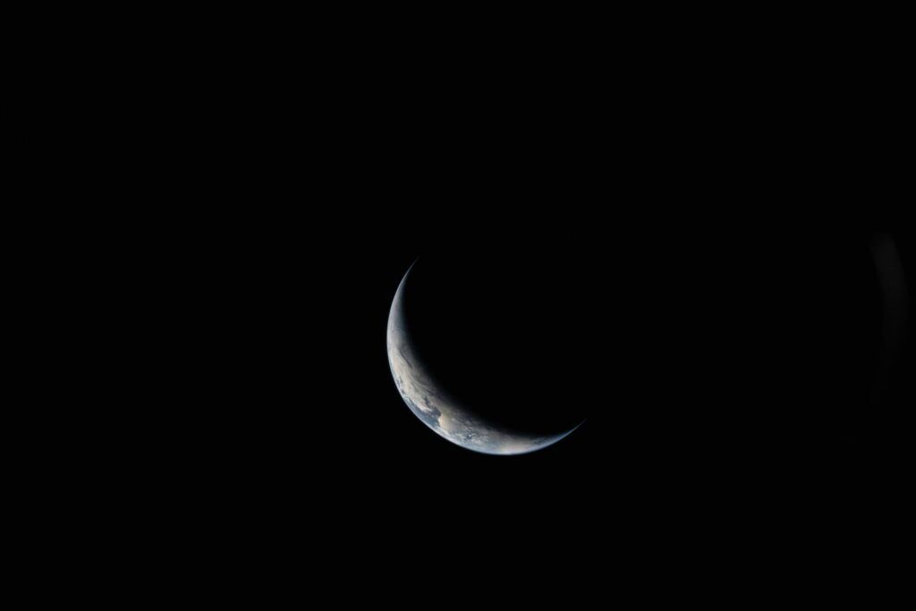 sliver of earth photographed from space against black space