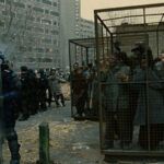 refugees locked in cages, in science fiction film Children of Men