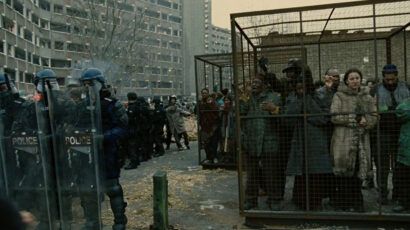 refugees locked in cages, in science fiction film Children of Men