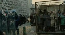 refugees locked in cages, in science fiction film Children of Men
